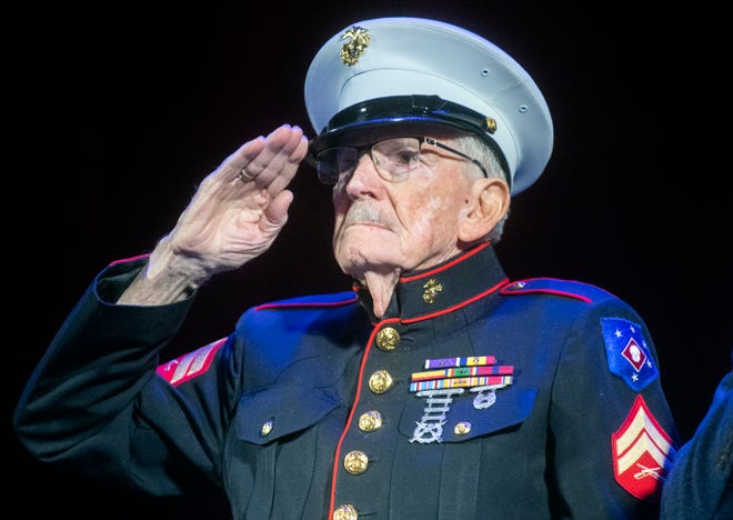 97-year-old Marine veteran Frank Wright salutes during the posting of the colors at the annual Veterans Day Tribute hosted by the United Veterans Council of San Joaquin County at the Bob Hope Theatre in downtown Stockton on Friday, Nov. 11, 2022.