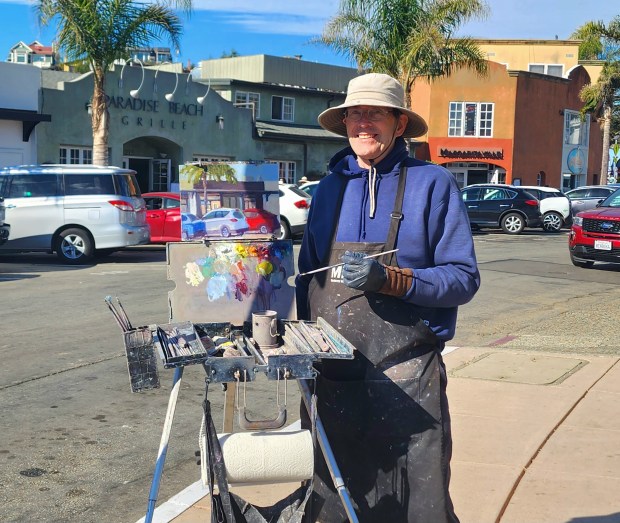 Redwood City resident Mark Monsarrat shows off his street scene at the 