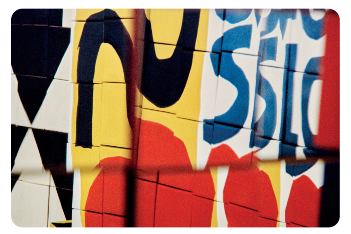 A close-up of some bright letters and graphics, daubed on a wall