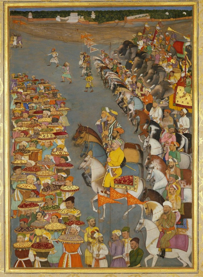 A legion of mounted Indian soldiers are met by groups of people carrying trays of food