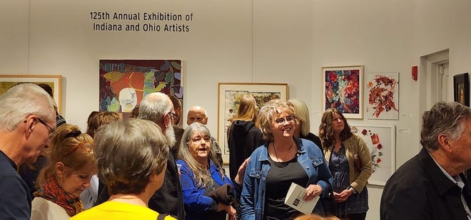 Attendees walk around the 125th Annual Exhibition of Indiana and Ohio Artists at the Richmond Art Museum, Thursday, Nov. 9, 2023.