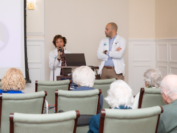 Drs. Henry and Jade Ranger from The Prescription Shoppe meet with residents at Williamsburg Landing on Nov. 13 for a presentation with residents and their families. Courtesy of Jade Ranger