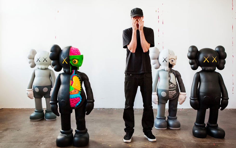 The artist KAWS with a selection from his COMPANION series.