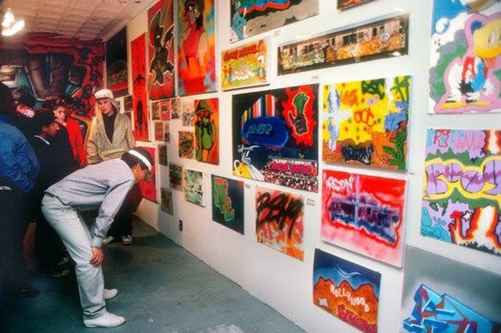 Patty Astor with Keith Haring and LA 2's The Smurfs at the FUN Gallery in February 1983.