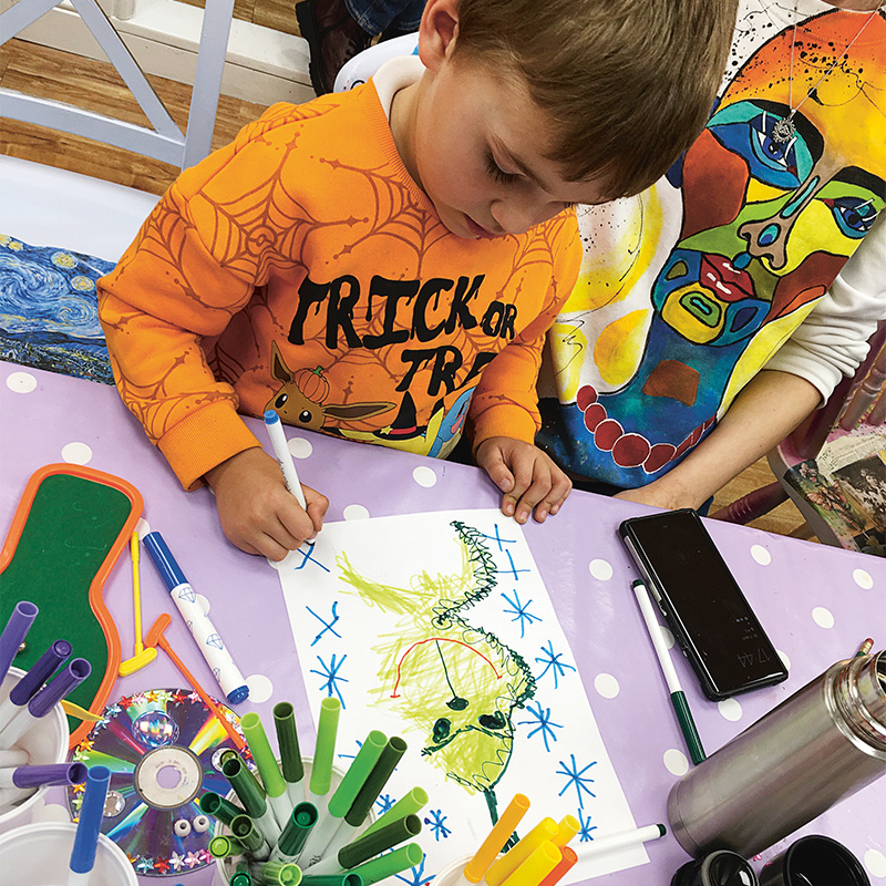 A child painting at a table