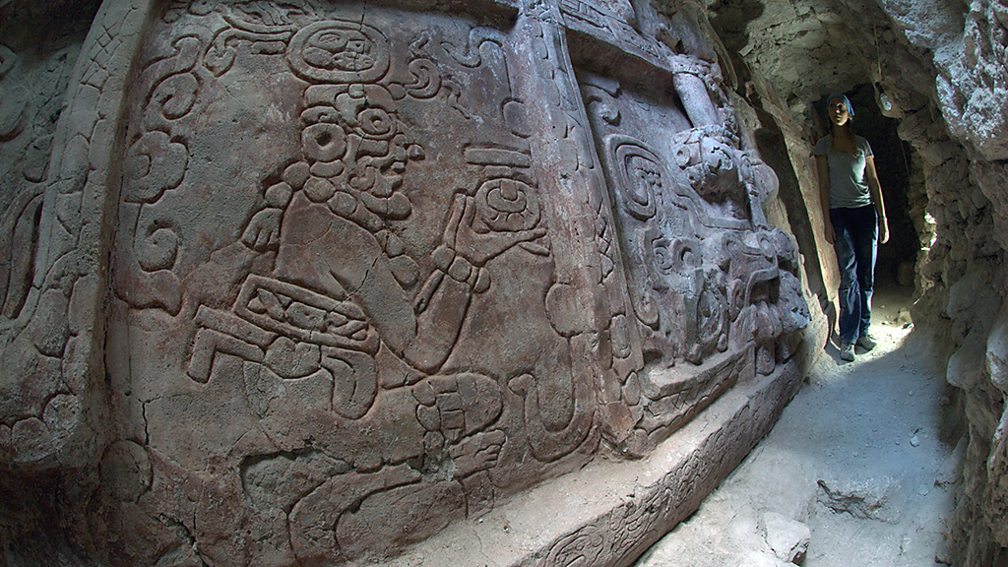 Holmul Archaeological Project In this frieze, an ancestor god offers a tamal to the Mayan king (Credit: Holmul Archaeological Project)