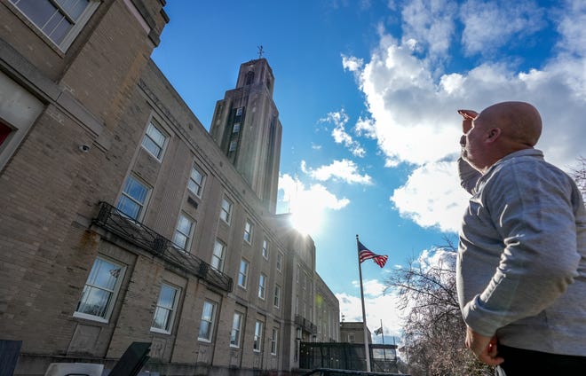 Pawtucket Department of Public Works Director Chris Crawley in front of City Hall, a Depression-era piece of Americana whose maintenance costs weigh heavily on the minds of city officials.