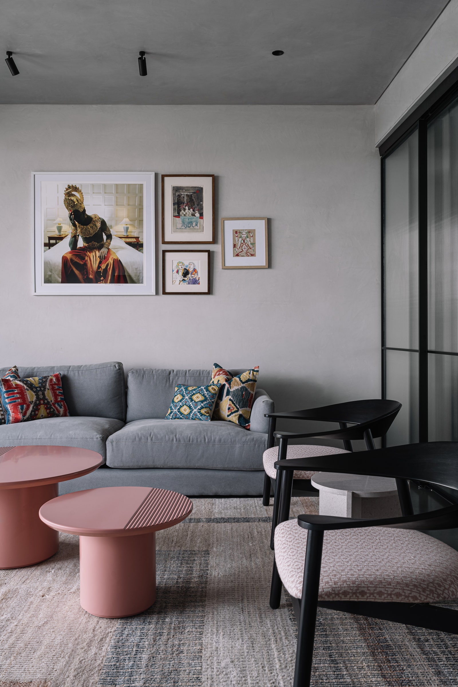 The cosy den comprises a soft velvet West Elm couch refurbished armchairs and blush pink nested coffee tables from...