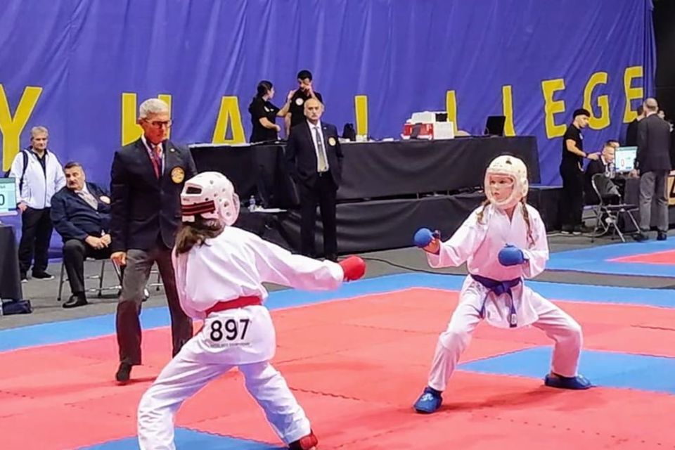 Amy Mangan from Killorglin (right) fighting for gold against England in kumite (sparring).