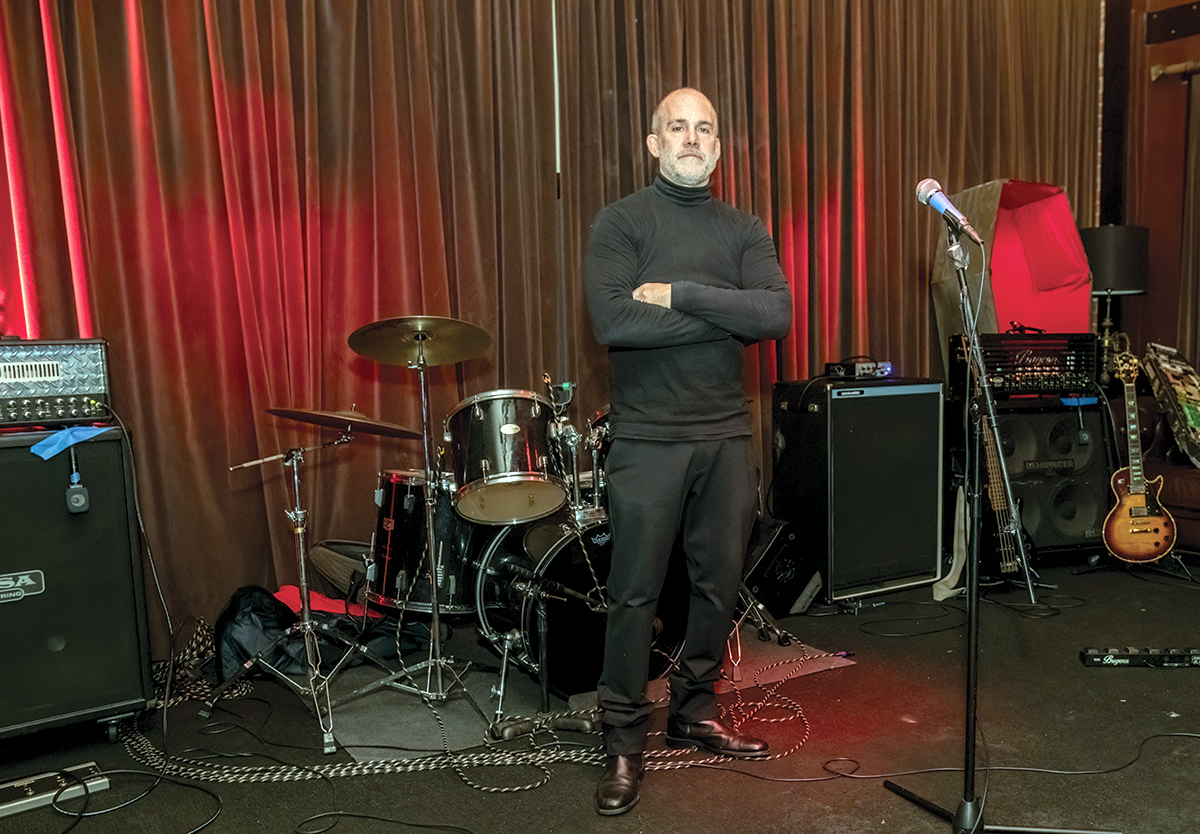 DOUBLE LIFE: Rick Sunderland, a gym and health teacher at Classical High School, opened live music venue Dusk on Harris Avenue in Providence in 2010 because of a passion for live music and a desire to showcase musicians and artists.  PBN PHOTO/MICHAEL SALERNO