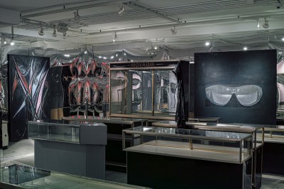 A mirrored gallery filled with empty display cases.