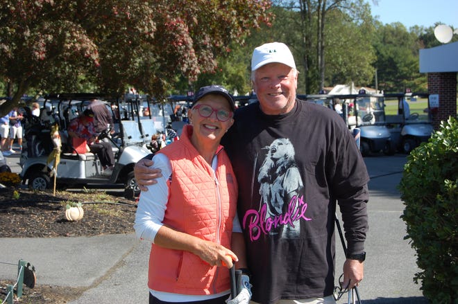 Lee and David Temby get ready to tee off at the Paul Kares Inaugural Rock & Roll Golf Fundraiser on Oct. 10 in Georgetown. Players were encouraged to wear a T-shirt saluting their favorite band.