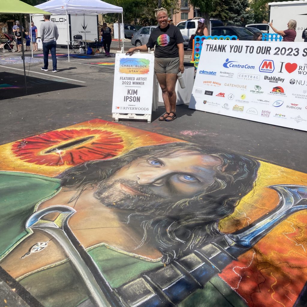 Kimberly Ipson stands next to Lord of the Rings chalk art piece, Provo, Utah, date unspecified | Photo courtesy of Kimberly Ipson, St. George News