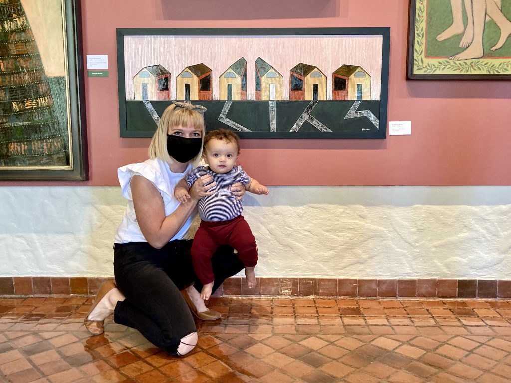 Kimberly Ipson holds her son next to her painting, location and date unspecified | Photo courtesy of Kimberly Ipson, St. George News