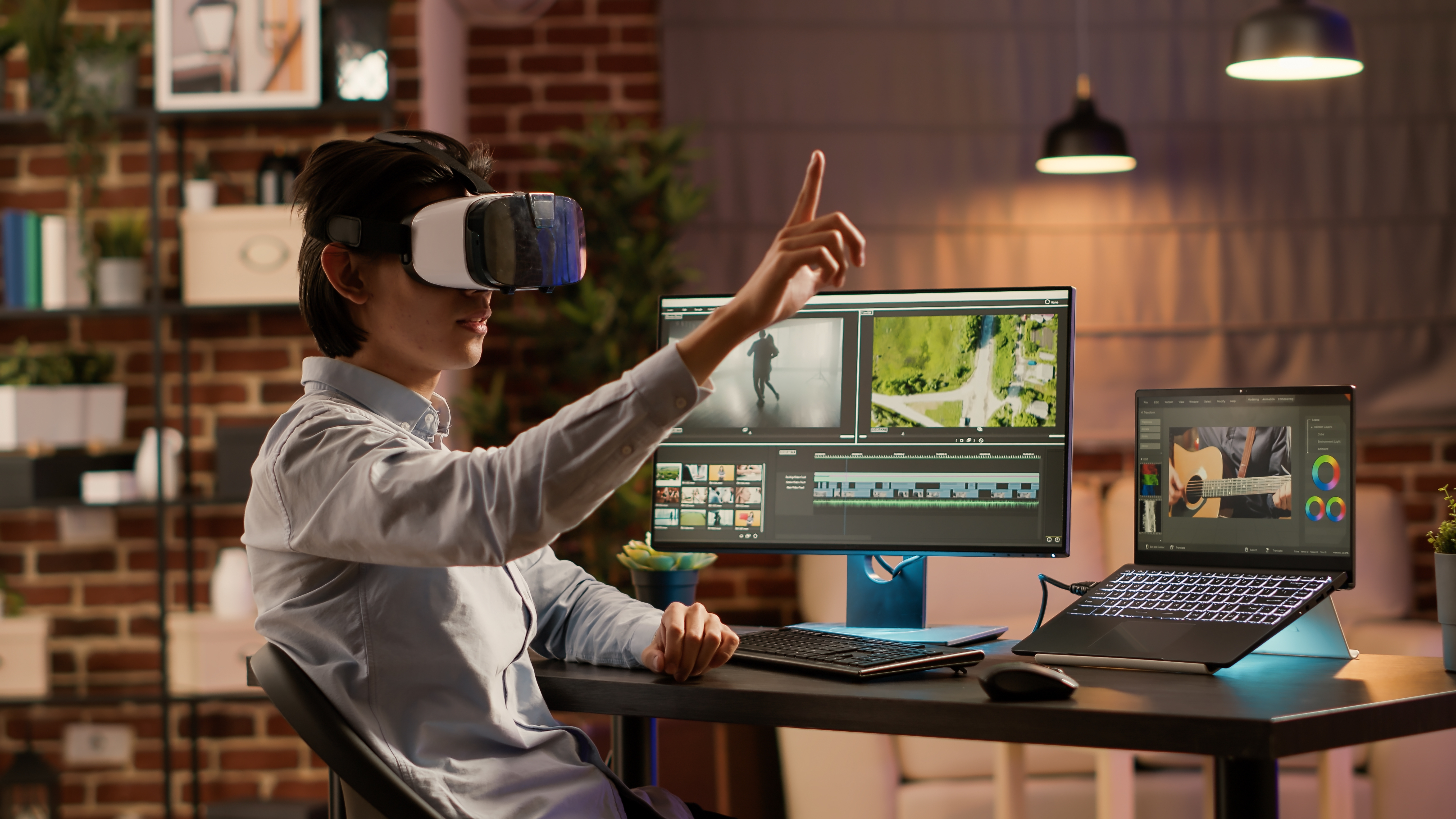 A woman with a VR headset on in front of a suite of video editing software