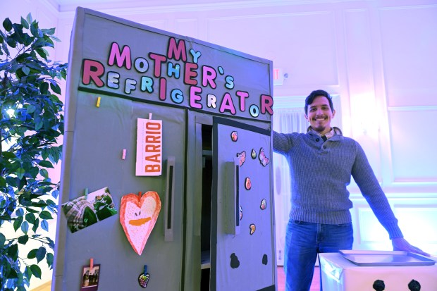 Anthony Orozco, director of operations for Barrio Alegria, with My Mother's Refrigerator at the Arts Market on Saturday at the WCR Center for the Arts, 140 N. Fifth St. (BILL UHRICH - READING EAGLE)