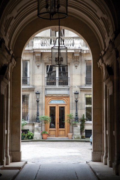Exterior of Bonham’s Paris headquarters, seen through an arch.