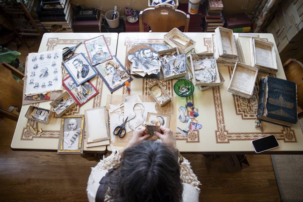 Donna Castellanos, an artist who refers to herself as a “rescuer of once-loved things,” prepares collages for an event at the National Portrait Gallery using recycled paper materials on Jan. 26, 2024.