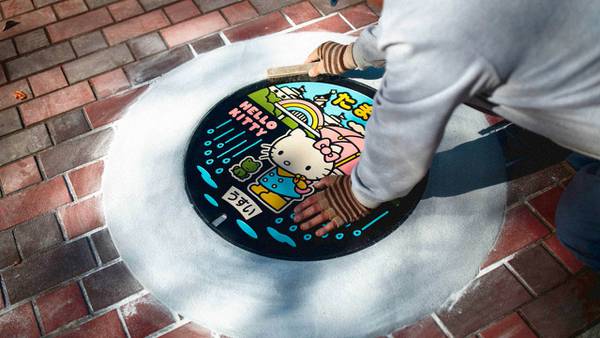 A manhole cover featuring a Hello Kitty design is installed in Japan.