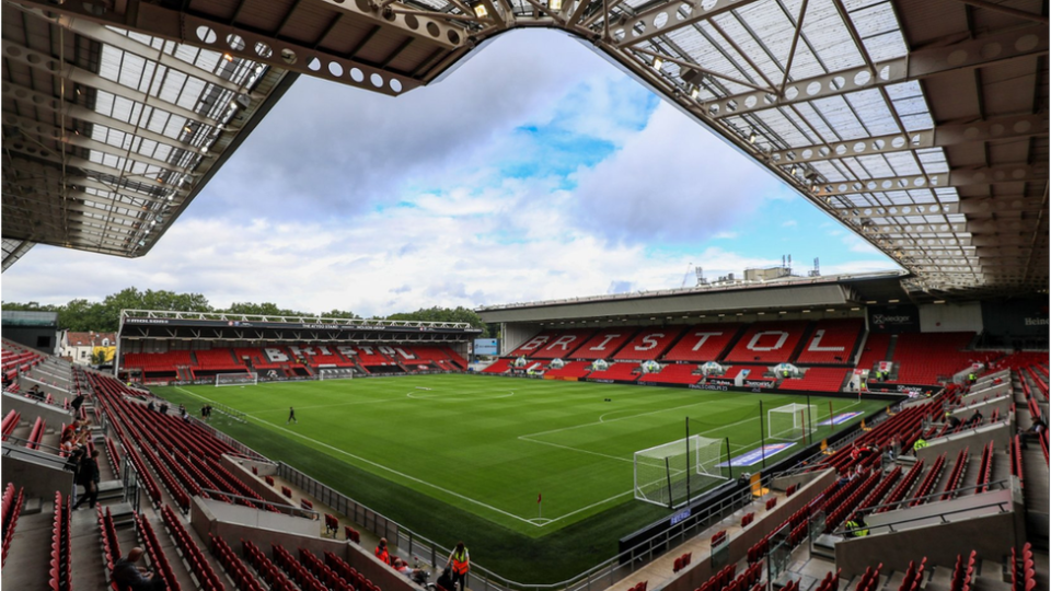 Photo of empty stands and pitch in Ashton Gate Stadium