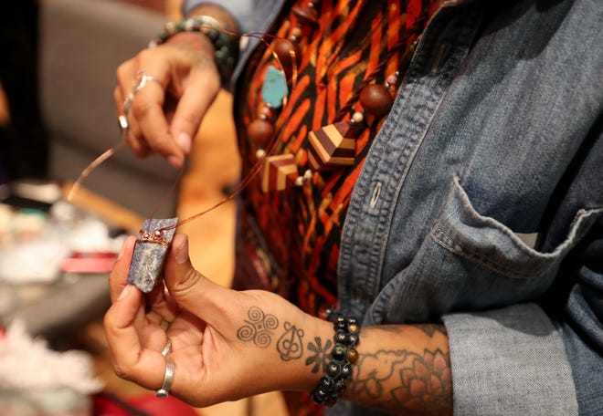 Rafaela Johnson, owner Vibez4Me, makes pendant in her booth during the 2nd annual Savannah Black Art Expo on Saturday, February 3, 2024 at the Savannah Cultural Arts Center.