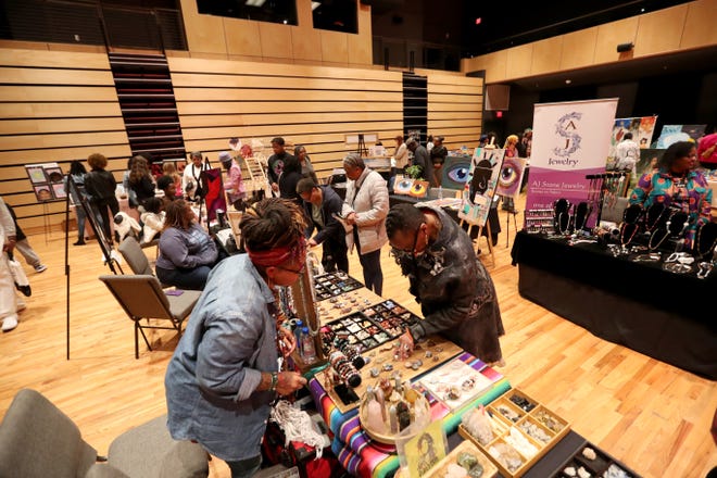 Patrons browse the many booths during the 2nd annual Savannah Black Art Expo on Saturday, February 3, 2024 at the Savannah Cultural Arts Center.