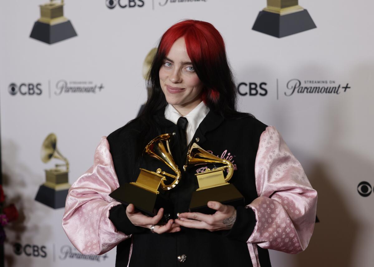 Billie Eilish, 22, holds her two latest Grammy Awards Sunday. She now has nine career wins.