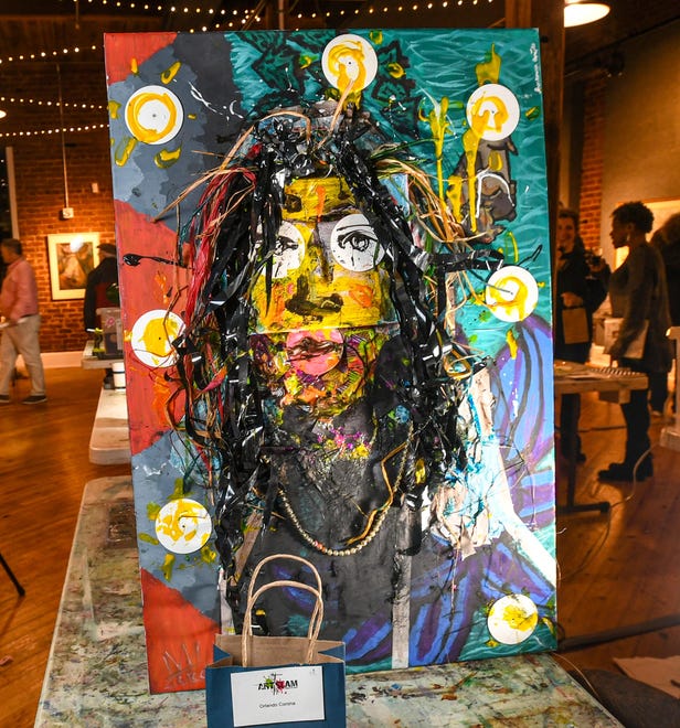 Orlando Corona finished mixed-media art during the 2024 Art Slam! competition at Anderson Arts Center Friday, February 9, 2024.