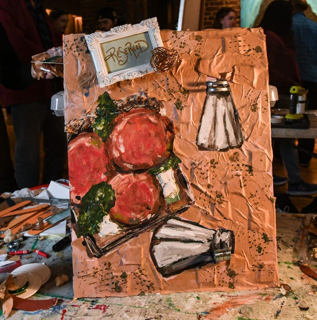 April Rollins finished mixed-media art during the 2024 Art Slam! competition at Anderson Arts Center Friday, February 9, 2024.