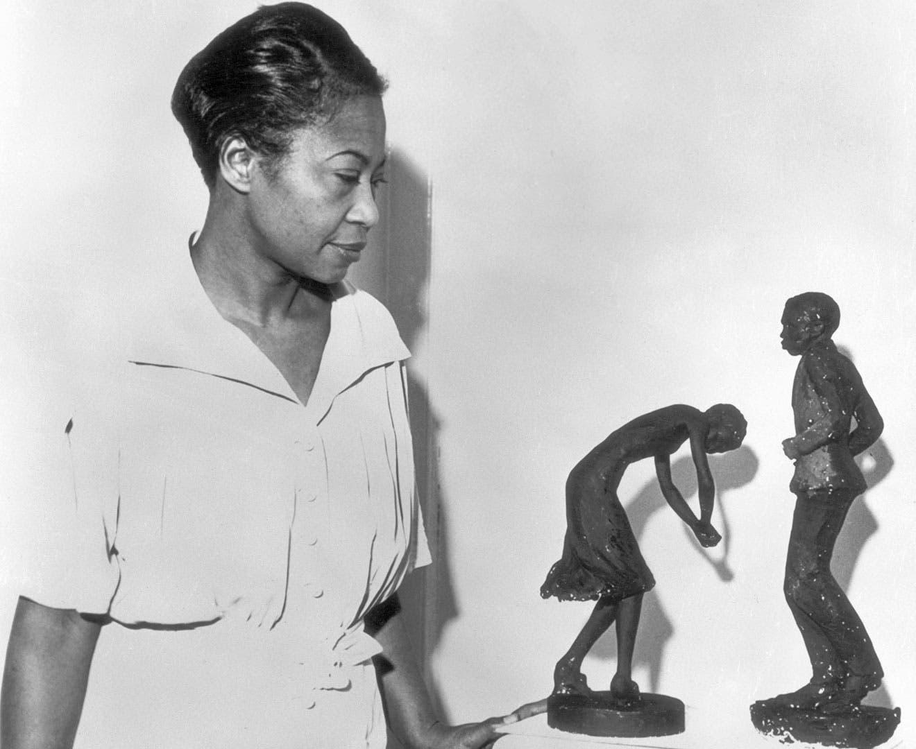 Augusta Savage with two of her sculptures, 1937.