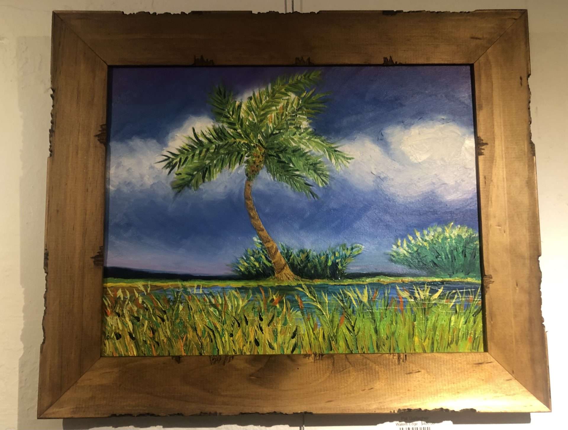 A landscape painting showing a palm tree against a blue and white sky. 