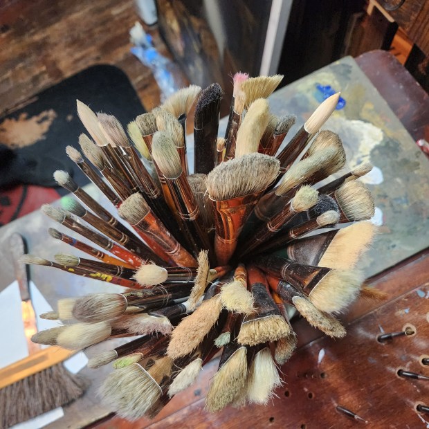 Just a few of artist Adrian Martinez's brushes. (BILL RETTEW/MEDIANEWS GROUP)