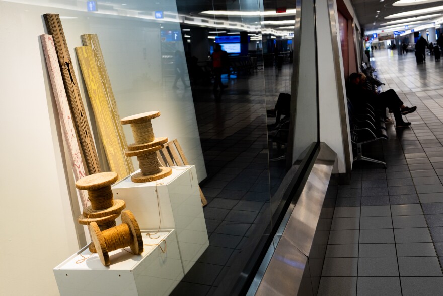 Douglas Dale's "A Frayed Knot" on Thursday, Feb. 15, 2024, in Terminal 1 of the St. Louis Lambert International Airport. The collection of yarn and wood sculptures seeks to draw inspiration from spaces where reality is the product of illusion: camp, drag, theater, and the club scene.