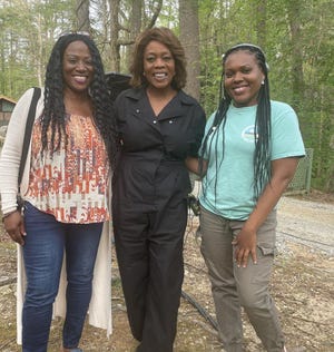Destiny Macon (right) and another attendee with Alfre Woodard (center) at a film summer camp.