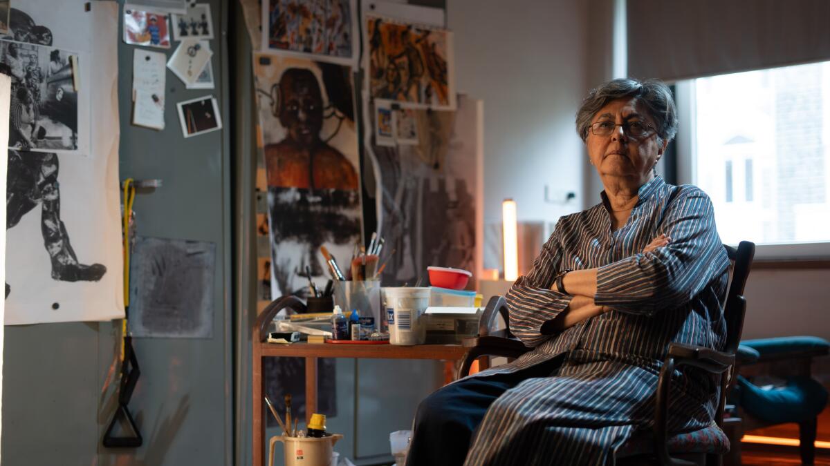 Visual artist Nalini Malani sits in her art studio.