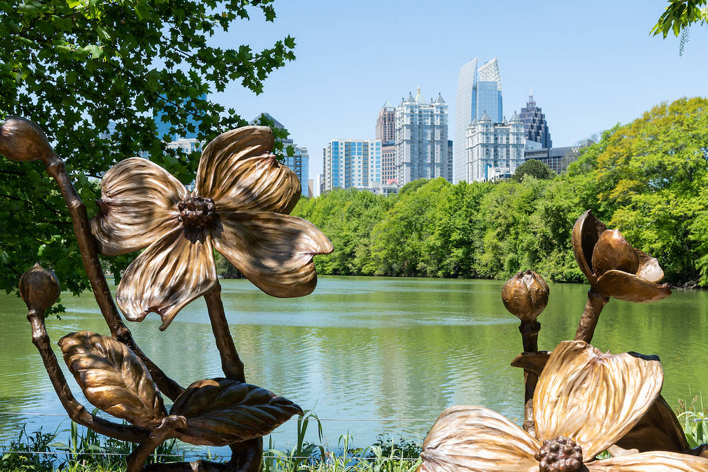 Atlanta, USA - April 20, 2018: Cityscape skyline view in Piedmont Park in Georgia urban city skyscrapers downtown at Lake Clara Meer with art decoration