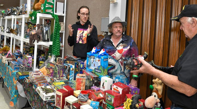 Carleton Bailie, in center, was one of the over 60 vendors. The Melbourne Toy and Comic Con was held Sunday, April 14 at the Melbourne Auditorium. The colorful event featured over 60 vendors, popular comic book artists, cosplayers, contests, panels, and several Hollywood guests.