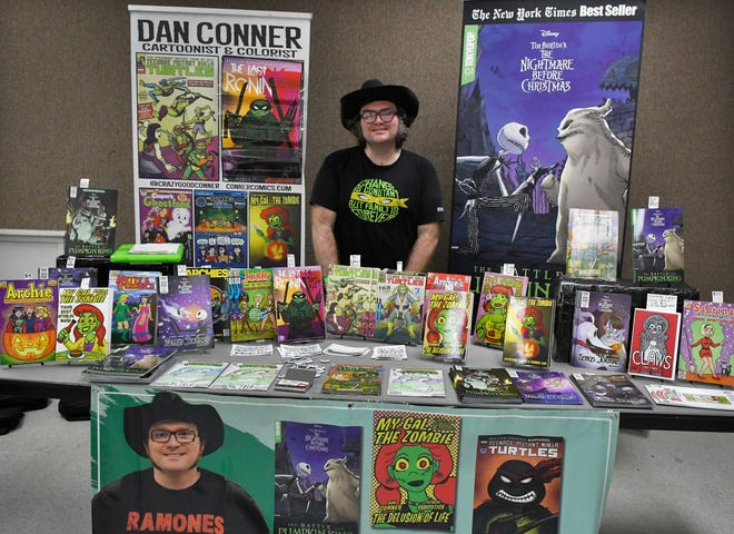 If you spotted the banner, it was easy to find cartoonist and colorist Dan Cooper at the Melbourne Toy and Comic Con at the Melbourne Auditorium.
