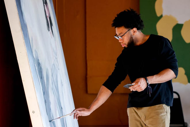 Syon Houston paints his piece "Fortitude" for the Fresh Paint mural project in Oklahoma City, on Monday, March 4, 2024.