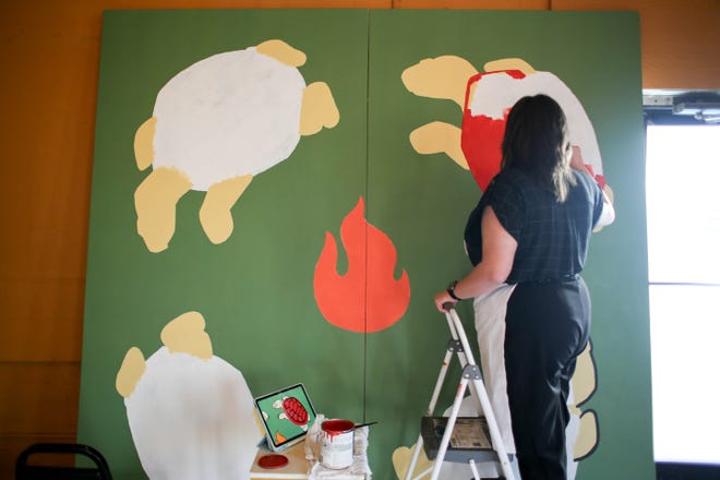 Makiya Deerinwater works on her piece "Unity" for the Fresh Paint mural project in Oklahoma City, on Monday, March 4, 2024.