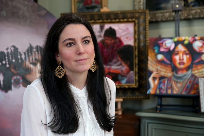 Wall High School art teacher Jill Alexander is shown amongst her work in her home studio Tuesday, April 23, 2024. While participating in an art show in Denver, four of her paintings were stolen.