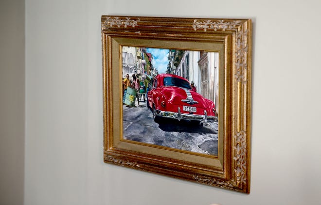 A print of "Havana Street" hangs in Wall HIgh School art teacher Jill Alexander's home studio Tuesday, April 23, 2024. While participating in an art show in Denver, four of her paintings — including the original of this one — were stolen.