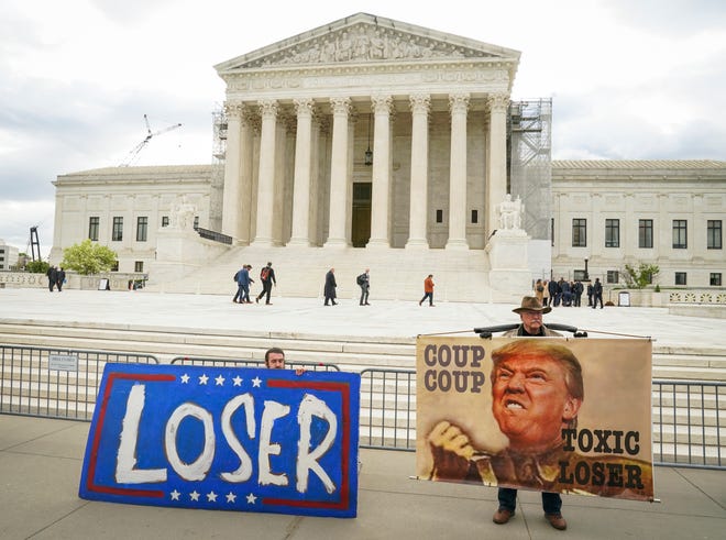 Protestors gather outside of the US Supreme Court as the Supreme Court justices hear oral arguments on whether former President Donald Trump is immune from criminal charges in his federal election interference case.