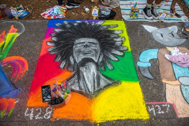 A stunning portrait sits on square 428, at the SCAD Sidewalk Arts Festival, on April 27, 2024, in Savannah, GA.