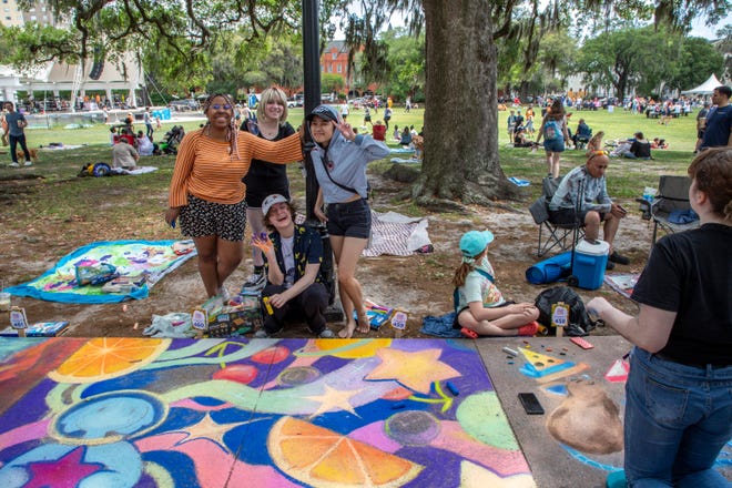 Alexia Baptiste, Leon Pave, Yeong Yuh Lin, and Sophie Chevis, show off their art, at the SCAD Sidewalk Arts Festival, on April 27, 2024, in Savannah, GA.