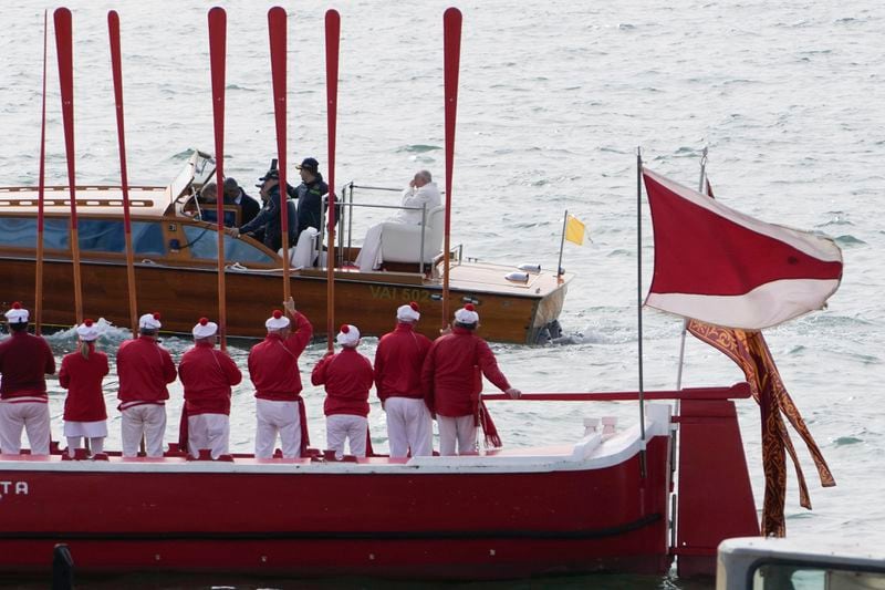 Pope Francis is greeted by gondoliers upon his arrival in Venice, Italy, Sunday, April 28, 2024. The Pontiff arrived for his first-ever visit to the lagoon town including the Vatican pavilion at the 60th Biennal of Arts. (AP Photo/Alessandra Tarantino)