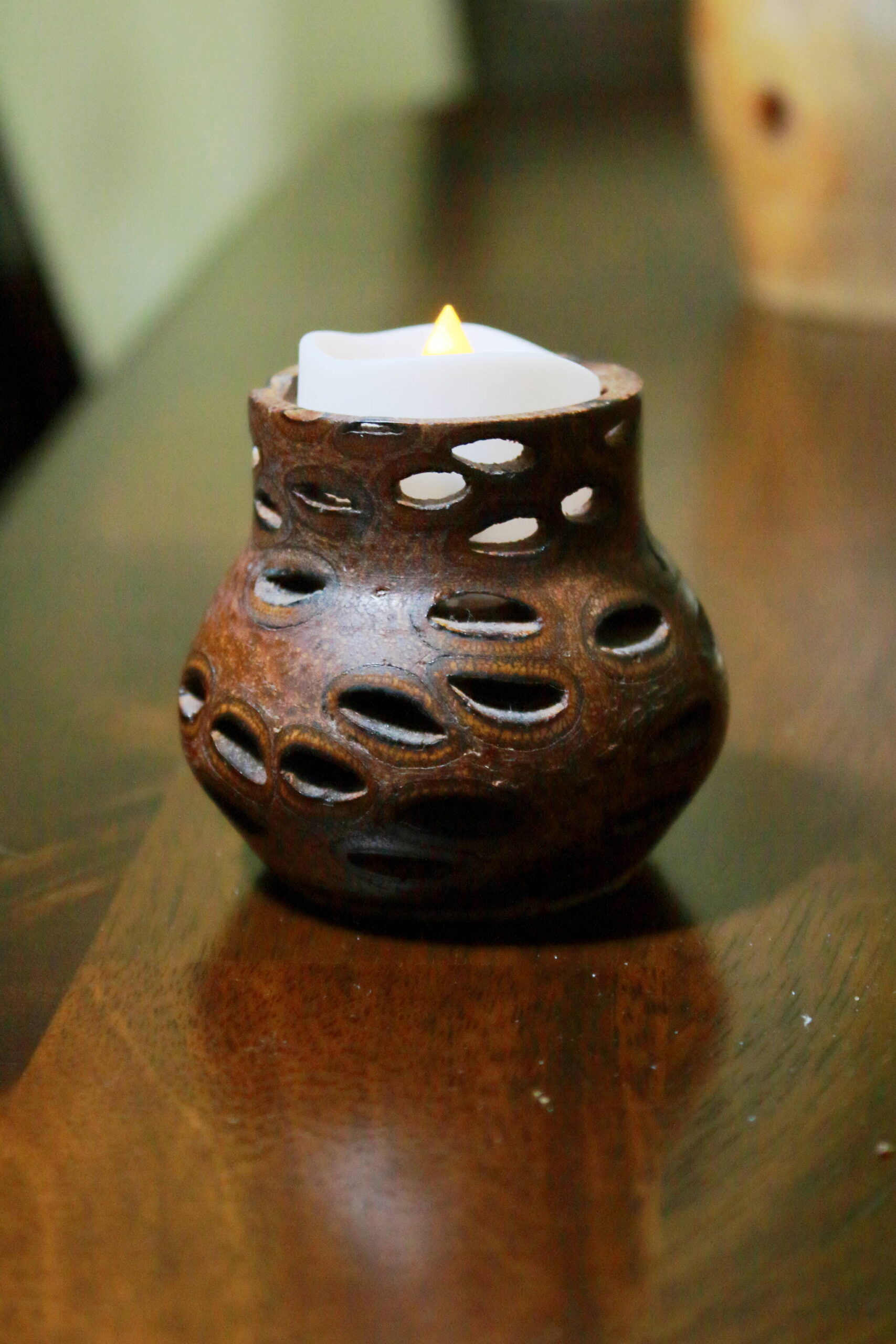 This candle holder is crafter from a single banksia seed pod from Australia, giving it the unique holes in its design. Photo by Keelin Everly-Lang / The Mirror