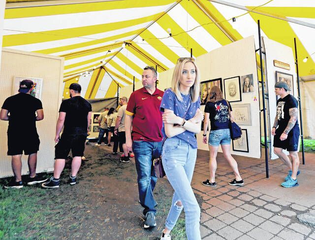Artists whose work is chosen for this years Fine Arts Fiesta, set for May 16-19, will see it on display under a tent on Wilkes-Barres Public Square, like the one in this scene from a previous Fiesta.
                                 Times Leader File Photo