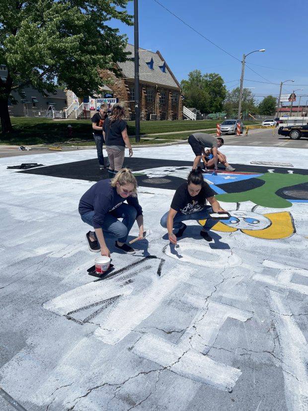 Students from Horizon Science Academy of Lorain, 760 Tower Blvd. in Lorain, help out with the East 31st Street and Pearl Avenue. temporary mural. (Submitted)