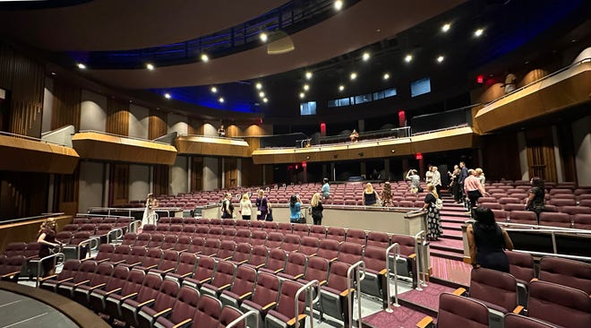 Guests on a tour of the new Booker High Visual and Performing Arts Center, stop to admire the new 406-seat Main Theater, following a ribbon-cutting ceremony Thursday morning.
